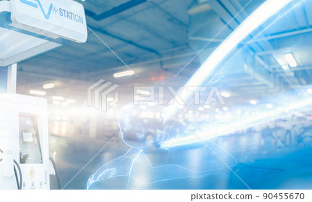 Blur EV car and electric car charging station in a futuristic vehicle concept. EV car charging point at the underground parking lot. Electric vehicle fast charge. Sustainable power. Green energy. Blur EV car and electric car charging station in a futuristic vehicle concept. EV car charging point at the underground parking lot. Electric vehicle fast charge. Sustainable power. Green energy. 90455670