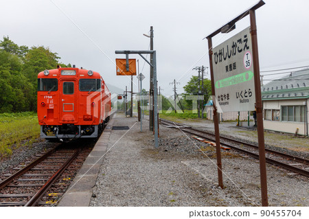 Diesel train on the Nemuro Main Line stopped at an unmanned station where the abolition of Hokkaido is being talked about 90455704