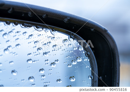 Water droplets on the side mirrors of the car Water droplets on the side mirrors of the car 90455816
