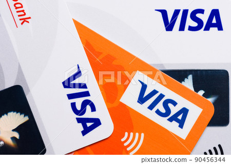 Close-up of Visa plastic credit payment cards with contactless pay symbol top view 90456344