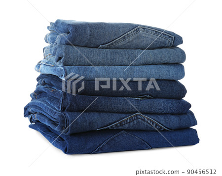 Stack of different jeans isolated on white Stack of different jeans isolated on white 90456512