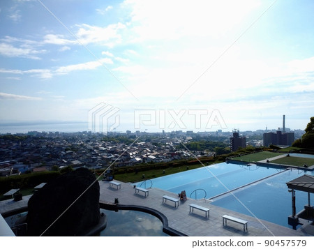 Hotel pool and city 90457579