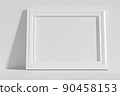 Horizontal rectangular photo frame on floor leaning at wall 90458153