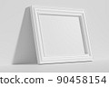 Horizontal rectangular photo frame on floor leaning at wall diagonal view 90458154