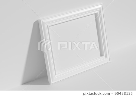 Horizontal rectangular photo frame on floor leaning at wall top diagonal view 90458155
