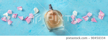 Rose perfume panorama. Floral fragrance bottle, overhead flat lay shot Rose perfume panorama. Floral fragrance bottle, overhead flat lay shot 90458334