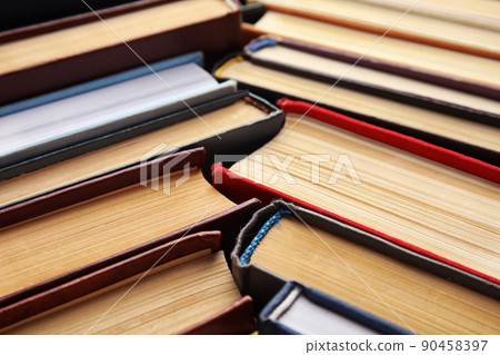 Many different hardcover books as background, closeup Many different hardcover books as background, closeup 90458397