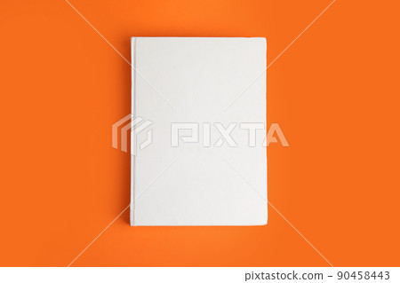 Book with blank cover on orange background, top view Book with blank cover on orange background, top view 90458443