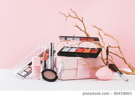 Beauty and makeup brushes golden branches on monochrome pink Beauty and makeup brushes golden branches on monochrome pink 90459063