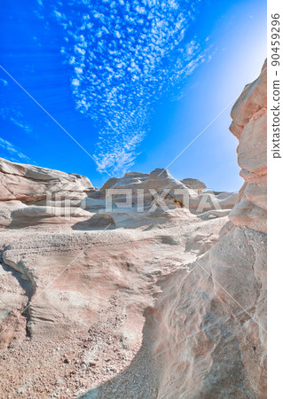 White rocks of Sarakiniko beach, Aegean sea, Milos island , Greece. No people, empty cliffs, summer sunshine, lunar landscape, deep blue sky, clouds White rocks of Sarakiniko beach, Aegean sea, Milos island , Greece. No people, empty cliffs, summer sunshine, lunar landscape, deep blue sky, clouds 90459296