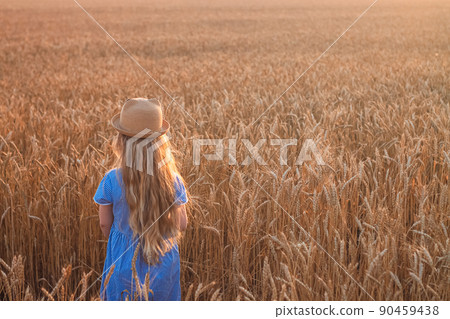 Child girl in straw hat dress in wheat field. Smiling kid in sunglasses sunset countryside. Cottagecore style aesthetic. Child girl in straw hat dress in wheat field. Smiling kid in sunglasses sunset countryside. Cottagecore style aesthetic. 90459438