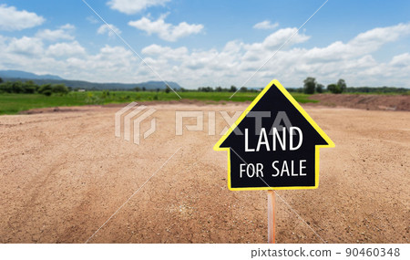 land for sale sign against trimmed lawn background. Empty dry cracked swamp reclamation soil, land plot for housing construction project in rural area and beautiful blue sky 90460348