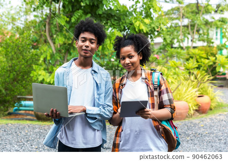Two students in school and working on laptop 90462063