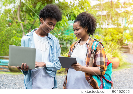 Two students in school and working on laptop 90462065