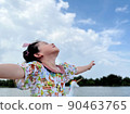 cute little girl looks into the bright day sky for new opportunities 90463765