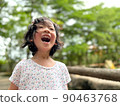 Cute little girl is laughing in the garden 90463768