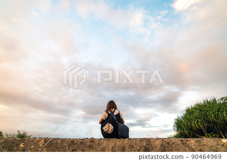 Woman in the sunset and back 90464969