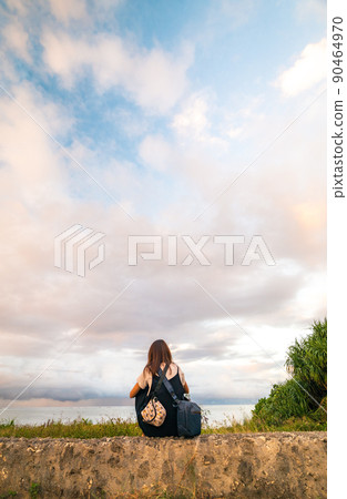 Woman in the sunset and back 90464970