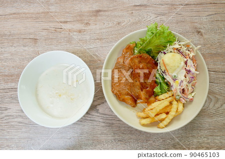 grilled pork steak dressing barbecue sauce with mashed potato and salad on plate couple corn soup in bowl 90465103