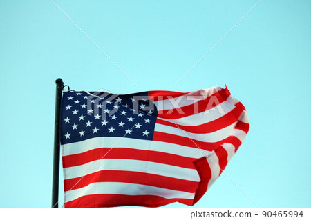 USA flag streaming in wind 90465994