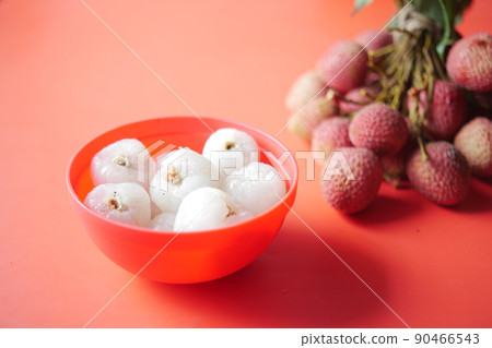Lychee fruits in a red color bowl Lychee fruits in a red color bowl 90466543