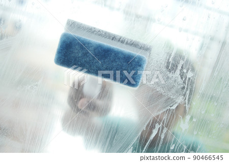 Close up of man hand cleaning window glass Close up of man hand cleaning window glass 90466545