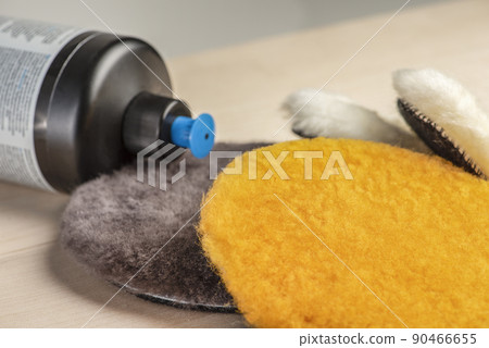 Paste for car polishing. Car body care. Polishing pads and polishing paste close-up. 90466655