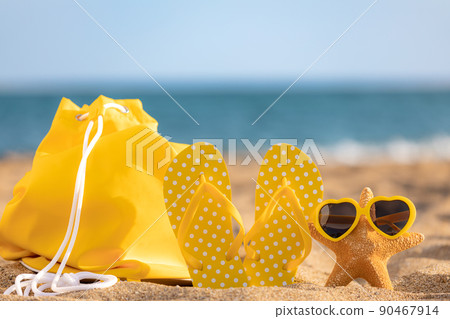Beach flip-flops on the sand 90467914
