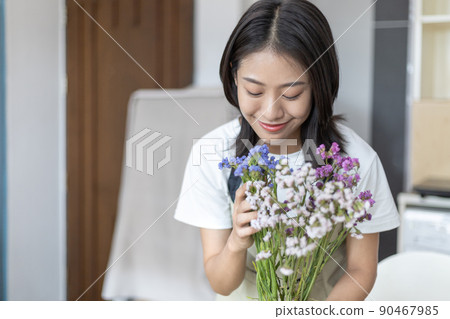 Bouquet, Asian woman puts a beautiful bouquet of colorful flowers in a vase to decorate the room, Freshen up and decorate the room, Decorations and arrangements, Flowers bunch, Arts and crafts. Bouquet, Asian woman puts a beautiful bouquet of colorful flowers in a vase to decorate the room, Freshen up and decorate the room, Decorations and arrangements, Flowers bunch, Arts and crafts. 90467985