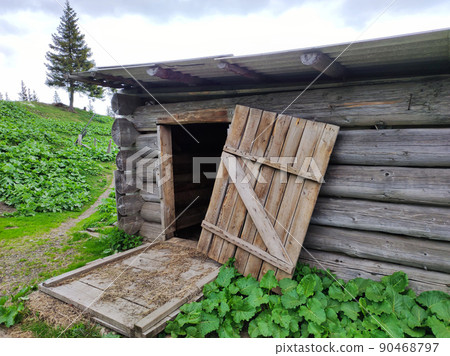 Open old door in wooden barn background 90468797