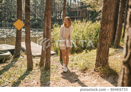 Joyous attractive elegant lady leaving the landing stage Joyous attractive elegant lady leaving the landing stage 90469735