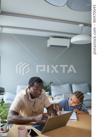 Black Father and Daughter at Home Lifestyle Scene 90470045