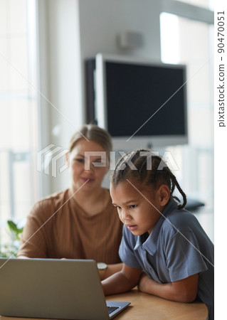 Mother and Daughter Speaking by Video Call 90470051