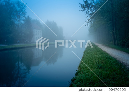 Beautiful spring sunrise over river banks. Morning fog in the forest Beautiful spring sunrise over river banks. Morning fog in the forest 90470603