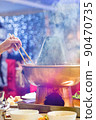 Chinese Traditional hot pot. Eating chopsticks 90470735