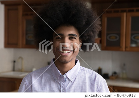 Young Black male look at camera with confident broad smile 90470918