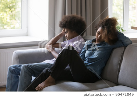 Sad depressed teenage Black boyfriend ignoring girlfriend, keeping silence 90471049