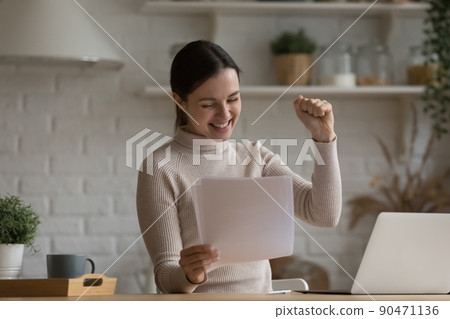 Excited euphoric student girl receiving admission letter from school 90471136