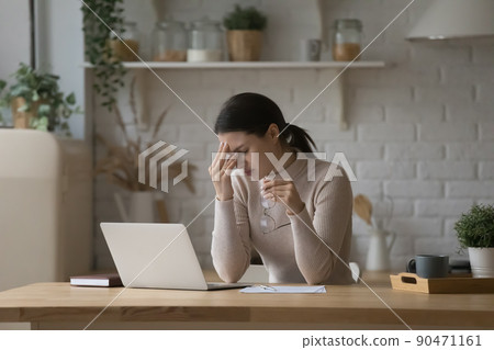 Frustrated tired laptop user woman feeling overworked, exhausted Frustrated tired laptop user woman feeling overworked, exhausted 90471161