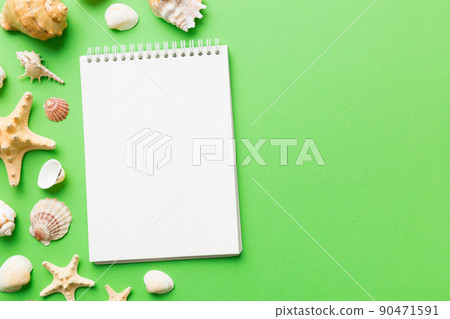 Blank writing book with summer beach accessories on background, copy space. Flat lay with copy space 90471591