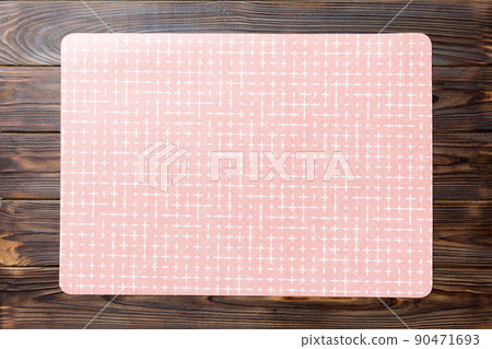 Top view of red tablecloth for food on wooden background. Empty space for your design 90471693