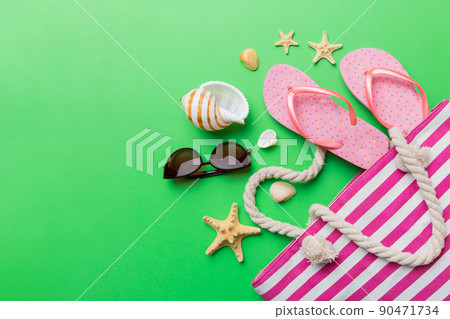 beach accessories flat lay top view on colored background Summer travel concept. Bag with starfish and sea shell. Top view beach accessories flat lay top view on colored background Summer travel concept. Bag with starfish and sea shell. Top view 90471734
