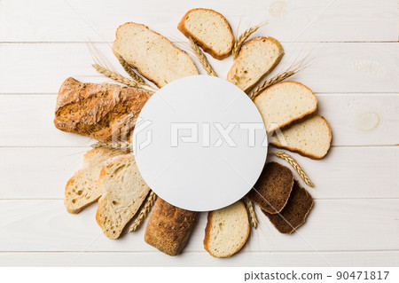 Minimalist paper blank mockup on background of Types of homemade bread. Different kinds of fresh bread as background, top view with space for your text or design 90471817
