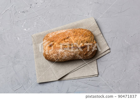 Fresh Homemade Whole Wheat Bread. bread on napkin on rustic background, fresh bread top view 90471837