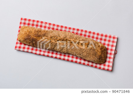 fresh crunchy french baguette on colored table. Top view Bakery products fresh crunchy french baguette on colored table. Top view Bakery products 90471846