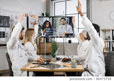 Medical workers voting for new project in modern clinic Medical workers voting for new project in modern clinic 90473756