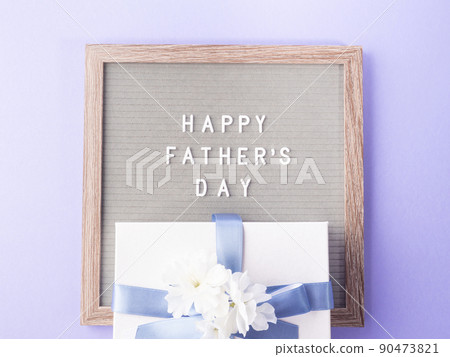 Fathers day purple greeting card with text on letter board Fathers day purple greeting card with text on letter board 90473821