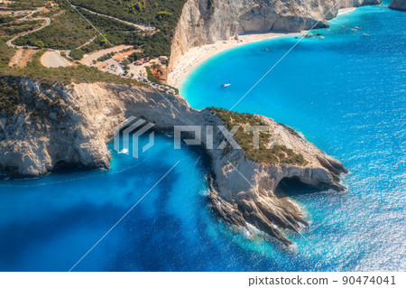 Aerial view of blue sea, mountains, white sandy beach at sunrise Aerial view of blue sea, mountains, white sandy beach at sunrise 90474041
