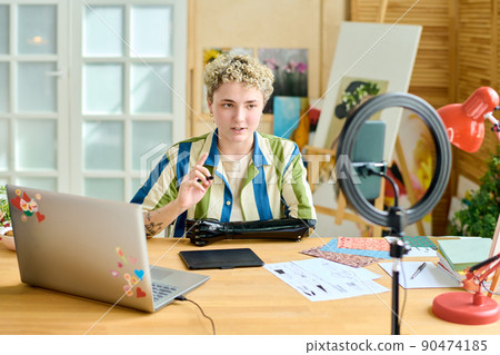 Young confident female blogger giving masterclass to online audience Young confident female blogger giving masterclass to online audience 90474185