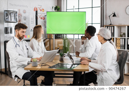 Doctors on meeting using monitor with chroma key screen Doctors on meeting using monitor with chroma key screen 90474267